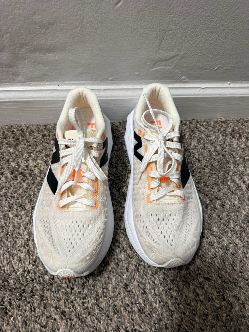 New Balance Cream Sneakers with Black and Orange Accents